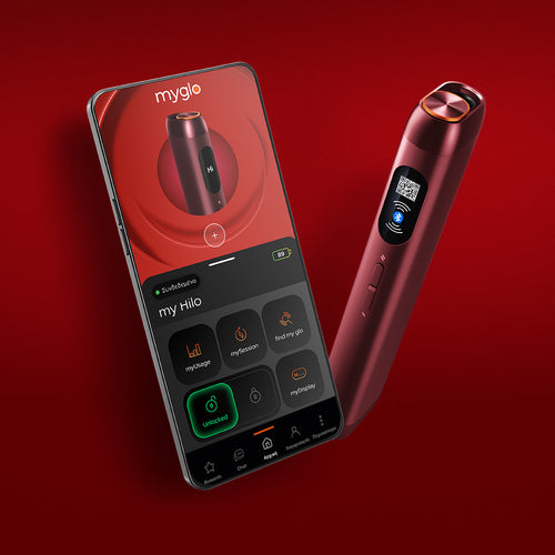 A red electronic device stands next to a smartphone displaying an app interface with the devices image and controls on a red background.