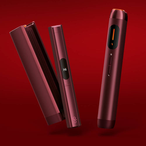 Three sleek, red electronic devices with buttons and small screens are displayed against a red background. One screen shows the word Hi. They appear modern and stylish, with cylindrical and rectangular shapes.