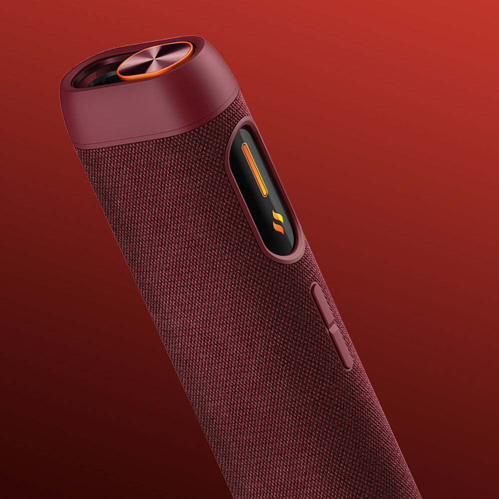 A close-up of the glo™ HILO Sleeve, a cylindrical, maroon sleeve with a premium fabric cover, orange button, and illuminated icons, set against a red gradient background.