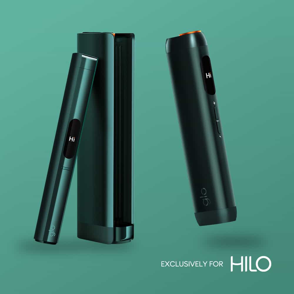 Two sleek, dark green virto™ Azure Tobacco devices on a teal background, one in a matching case, with “EXCLUSIVELY FOR HILO” text in the lower right corner.
