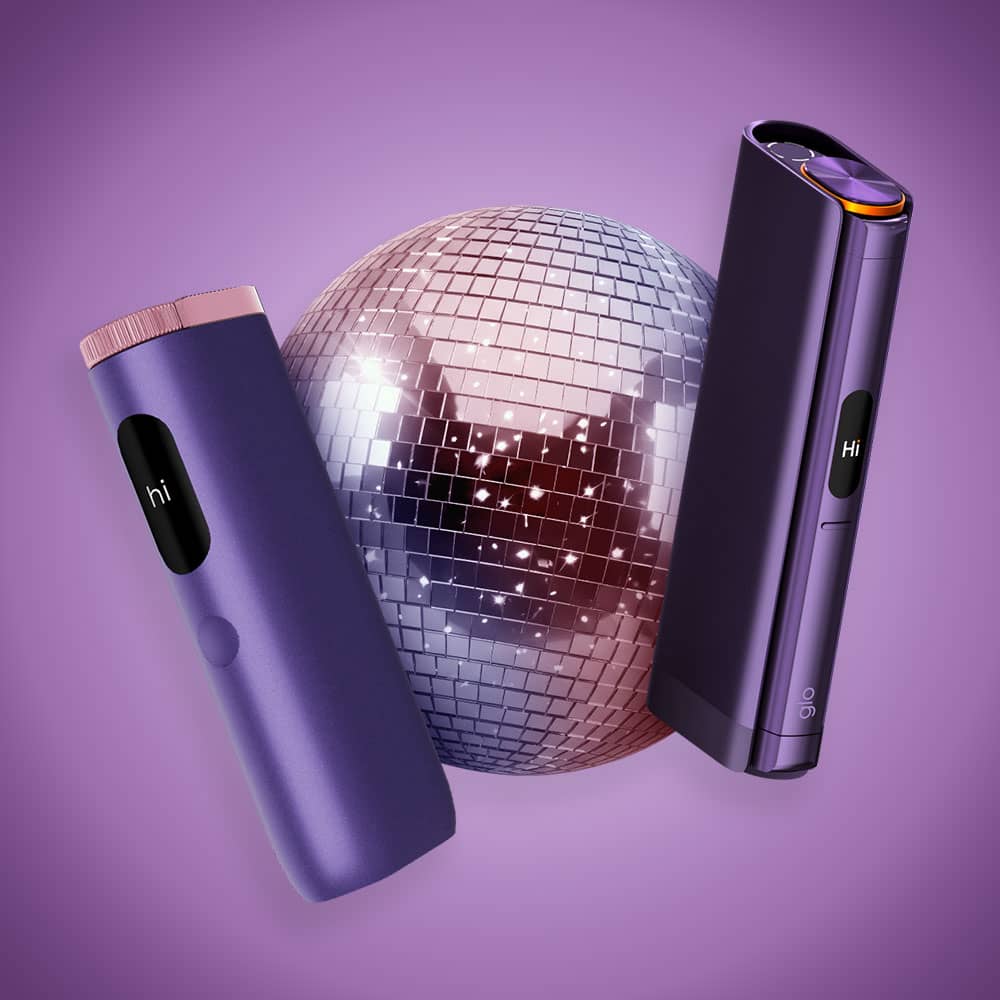 Two sleek, purple electronic devices with hi on their displays are positioned on either side of a shiny disco ball against a purple gradient background.