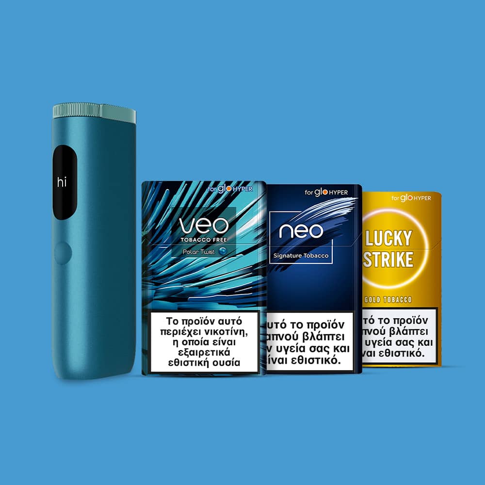 A blue electronic tobacco heating device stands upright next to three tobacco product packs labeled Veo, Neo, and Lucky Strike, each displaying Greek health warnings, against a solid blue background.